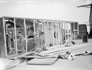 Asisbiz Curtiss Tomahawk IIb RAF 107MU RAF Fitters uncrate the wing and tailplane sections at Kasfareet Egypt IWM CM1096