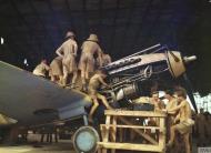 Asisbiz Curtiss Tomahawk RAF in a makeshift hangar maybe at Takoradi 1943 IWM TR824