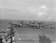 Asisbiz Fleet Air Arm Grumman Hellcat I preparing for take off aboard HMS Ravager IWM A21294