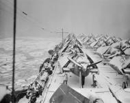 Asisbiz RN carrier HMS Emperor off Newfoundland with her cargo of frozen Grumman Hellcats IWM A23070