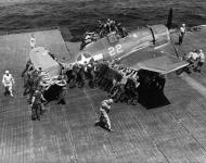 Asisbiz Grumman F6F 3 Hellcat VF 16 White 22 being positioned for launch CV 16 USS Lexington 1944 01