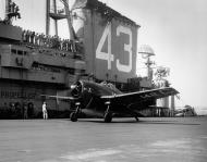 Asisbiz Grumman F6F 5B Hellcat VF 17 White C142 preparing for launch CVB 43 USS Coral Sea 28th Mar 1948 01