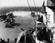 Asisbiz Grumman F6F 5 Hellcats VF 3 and VF 12 are on the deck CV 10 USS Yorktown off Iwo Jima D Day 01