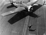 Asisbiz Grumman F6F 5P Hellcats VF 84 White 133 preparing to launch CV 17 Bunker Hill Feb 1945 01