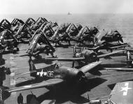 Asisbiz Grumman F6F 5P Hellcats VF 84 White 136 133 preparing to launch CV 17 Bunker Hill Feb 1945 01