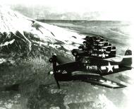 Asisbiz Grumman F6F 5N Hellcat VMFN 541 White FN78 FN80 FN81 FN84 and FN77 flying over Japan 1945 01