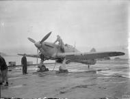 Asisbiz Fleet Air Arm 801NAS Sea Hurricane I M2K V7077 being refueled on board HMS Argus IWM A18870