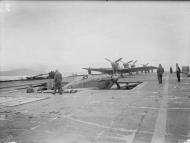 Asisbiz Fleet Air Arm 801NAS Sea Hurricane M2I being moved above decks aboard HMS Argus off Lamlash IWM A18881