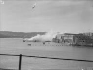 Asisbiz Harbour craft making a smoke screen at HMS Talbot the Royal Naval Submarine Base at Malta IWM A14392
