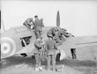 Asisbiz Hurricane I RAF 73Sqn being refuelled and re armed at Reims Champagne France 1940 IWM C1546
