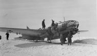 Asisbiz Ilyushin IL 4 lies abandoned after landing being inspected by German Troops 01