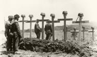 Asisbiz German soldiers pause before the graves of their comrades Bundesarchiv