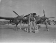 Asisbiz P 38H Lightning 8AF 20FG Ground personnel preparing aircraft for their next mission to France October 1943 FRE2396