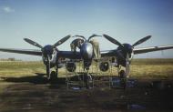 Asisbiz USAAF 8AF 7th Photographic Reconnaissance Group fit cameras into an F 5 Lightning before a long range mission 01.