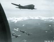 Asisbiz P 39 Airacobra 5AF 35FG41FS escorting 41 38678 C 47 Dakota 374TCG6TCS 62 Swamp Rat II over New Guinea 7th Jan 1944 NA521