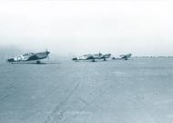 Asisbiz Curtiss P 40F Warhawk 57FG65FS Unc A Bud White 44 with 43 and 42 waiting for take off Burg El Arab Oct 1942 NA709