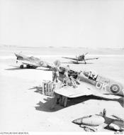 Asisbiz Curtiss P 40E Kittyhawk RAAF 450Sqn OK Diamond FL885 at Malta is prepared for its mission Apr 1943 AWM MEA0199