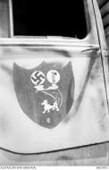 Asisbiz Emblem RAAF 450Sqn mock coat of arms at Kairouan Tunisia 18th Apr 1943 AWM MEC0452