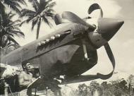 Asisbiz Curtiss P 40N Kittyhawk RAAF Harold Mansfield assessing repairs at Morotai Halmahera Isl 17th Jan 1945 AMW OG2056