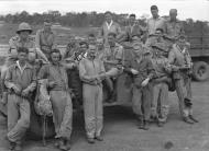 Asisbiz Aircrew RNZAF 14Sqn pilots with a Dodge weapons carrier grouped together after a patrol at Guadalcanal 01