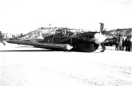 Asisbiz Curtiss P 40M Warhawk RNZAF 18Sqn M Black 37 belly landing on Munda airfield 01