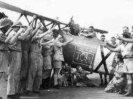 Asisbiz SAAF 3Sqn pilots and ground crew celibrate their 101 victory on a captured Italian CR 42 IWM MH5886