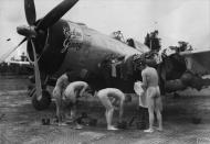 Asisbiz USAAF Republic P 47D Thunderbolt 10AF 50FG Cyclone Ginner with pilots having a wash 7th Jul 1944 01