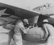 Asisbiz USAAF Republic P 47D Thunderbolt 1ACG being fitted with Napalm at its base in India 1944 01