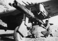 Asisbiz USAAF Republic P 47D Thunderbolt 12AF 324FG ground crew fit Bazooka tubes to the aircraft FRE10970