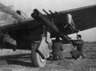 Asisbiz USAAF Republic P 47D Thunderbolt 12AF 324FG ground crew fit Bazooka tubes to the aircraft FRE10972