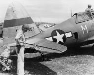 Asisbiz USAAF Republic P 47D Thunderbolt 7AF 318FG M Maj Harry McAfee n Col Louis Sanders inspect damage FRE9444