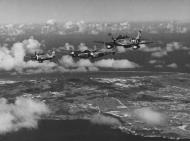 Asisbiz 44 63423 P 51D Mustang 7AF 15FG47FS 15 Squirt Col James O Beckwith CO leads Mustangs of the 45FS over Saipan 1945 03