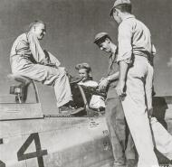 Asisbiz P 51D Mustang 20AF 506FG458FS FltOff Norman Dostal sitting on the canopy at Iwo Jima 1945 01