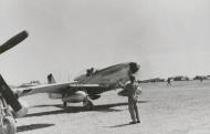 Asisbiz P 51D Mustang 7AF 15FG47FS 165 being guided for parking at Iwo Jima 1945 01