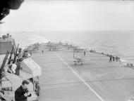 Asisbiz Fleet Air Arm 887NAS n 894NAS Seafires aboard HMS Indefatigable with HMS Jamaica Aug 1944 IWM A25082