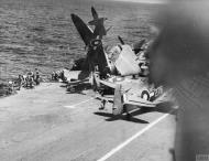 Asisbiz Fleet Air Arm 894NAS Seafire White S117 landing mishap HMS Indefatigable Okinawa Jun 1945 IWM A29715