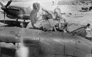Asisbiz Spitfire MkVcTrop RAF ground crew refuelling from a petrol tin at Ta Kali Malta IWM CM3214
