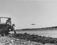 Asisbiz Spitfire LFIXc RAF 154Sqn HTV landing in Corsica with 815th Engineer Aviation Battalion 01