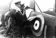 Asisbiz Aircrew Luftwaffe pilots looking over the wreck of P7665 YTL left side 01