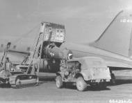 Asisbiz 41 12411 Curtiss C 46A Commando 1TCG3TCS loaded with a aircraft for China at Chabua India 1943 NA586