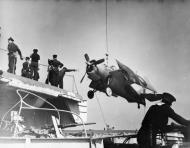 Asisbiz Fleet Air Arm Martlet MkI being winched aboard HMS Empress at Norfolk Virginia IWM A26813