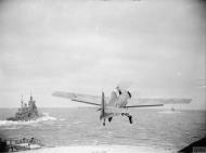 Asisbiz Fleet Air Arm Martlet taking off from HMS Furious with HMS Duke of York 6 9th Jul 1943 IWM A17994