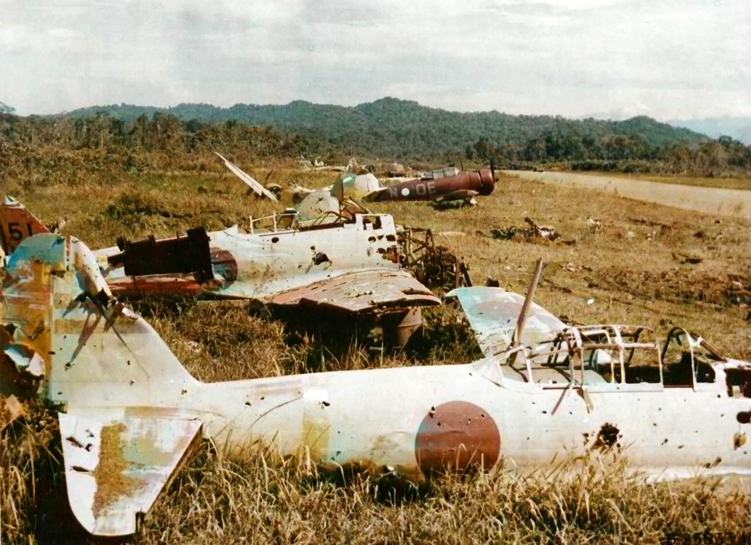 CAC Wirraway RAAF 24Sqn QEN surrounded by Japanese Zero's destroyed at Lae New Guinea 5th Nov 1943 01