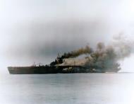 Asisbiz USS Bunker Hill (CV 17) after being hit by Kamikaze planes during the Okinawa operation 11th May 1945 80 G 373792