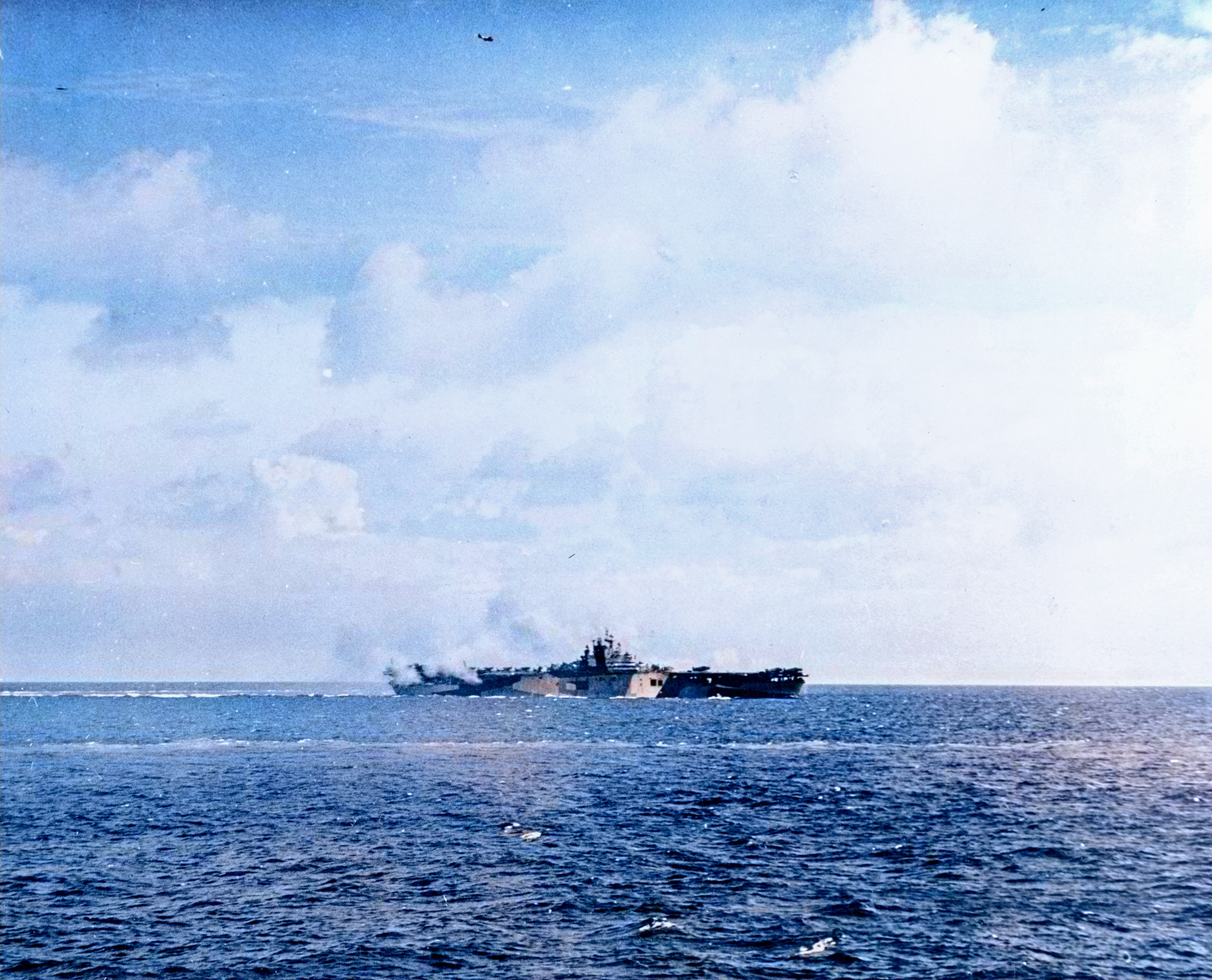 USS Bunker Hill (CV 17) after a near miss by Japanese air attack 19th June 1944 80 G 45904