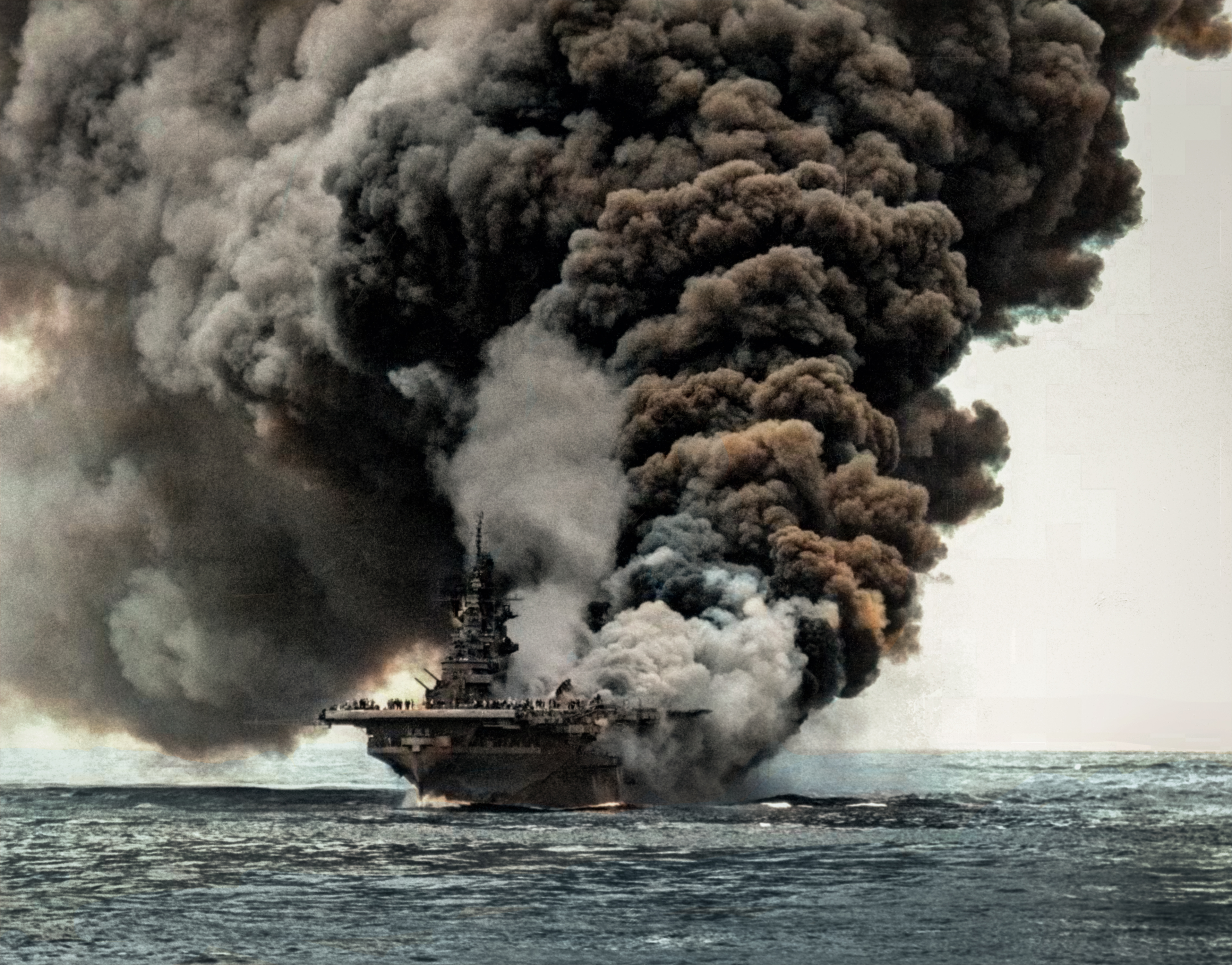 USS Bunker Hill (CV 17) after being hit by Kamikaze planes during the Okinawa operation 11th May 1945 80 G 274266