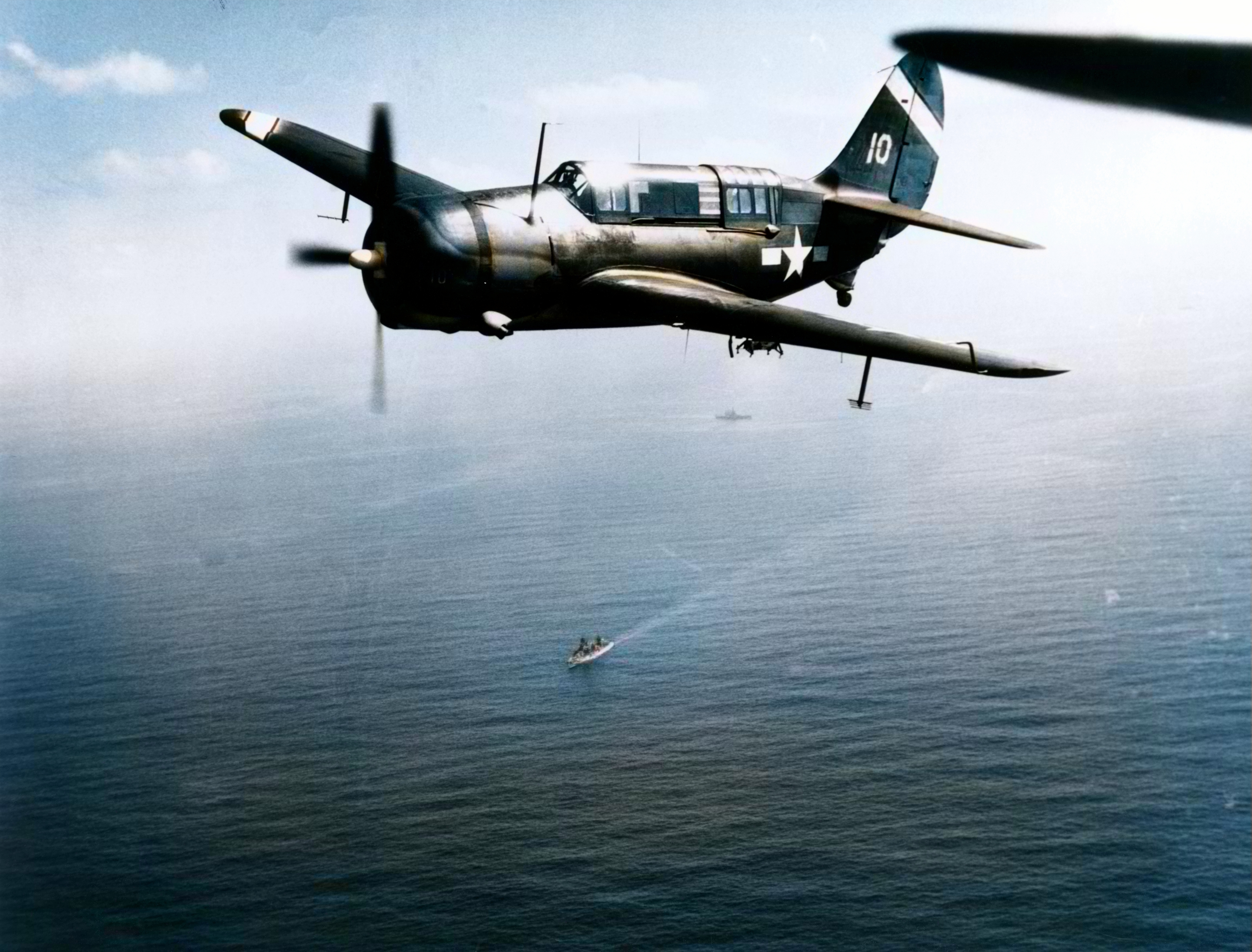 Asisbiz Curtiss SB2C 3 Helldiver from USS Hancock (CV-19) during strikes on Iwo Jima on 19th Feb 1945 80 G 304721