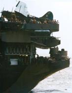 Asisbiz Curtiss SB2C Helldiver on the flight deck wearing Hancock's horseshoe tail marking USS Hancock (CV 19) Dec 1944 80 G K 15888