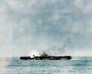 Asisbiz USS Hancock (CV 19) pictured after being hit by a kamikaze aircraft off Okinawa 7th Apr 1945 ASC1