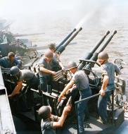 Asisbiz USS Hornet II (CV 12) 40mm gun crews protecting their ship as her planes hit Tokyo Japan 16th Feb 1945 80 G 416841